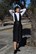 Vestido pichi polipiel reciclada negra con textura, abotonado en delantero - Imagen 1